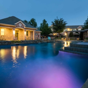 Alternative view of internally lit fountain at second pool at Villas at evening time