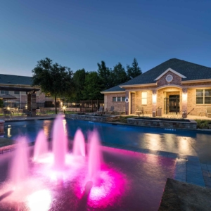 internally lit fountain at second pool at Villas at evening time